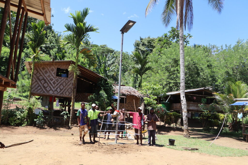 Solar street lights being installed in Sololo, Papua New Guinea.
