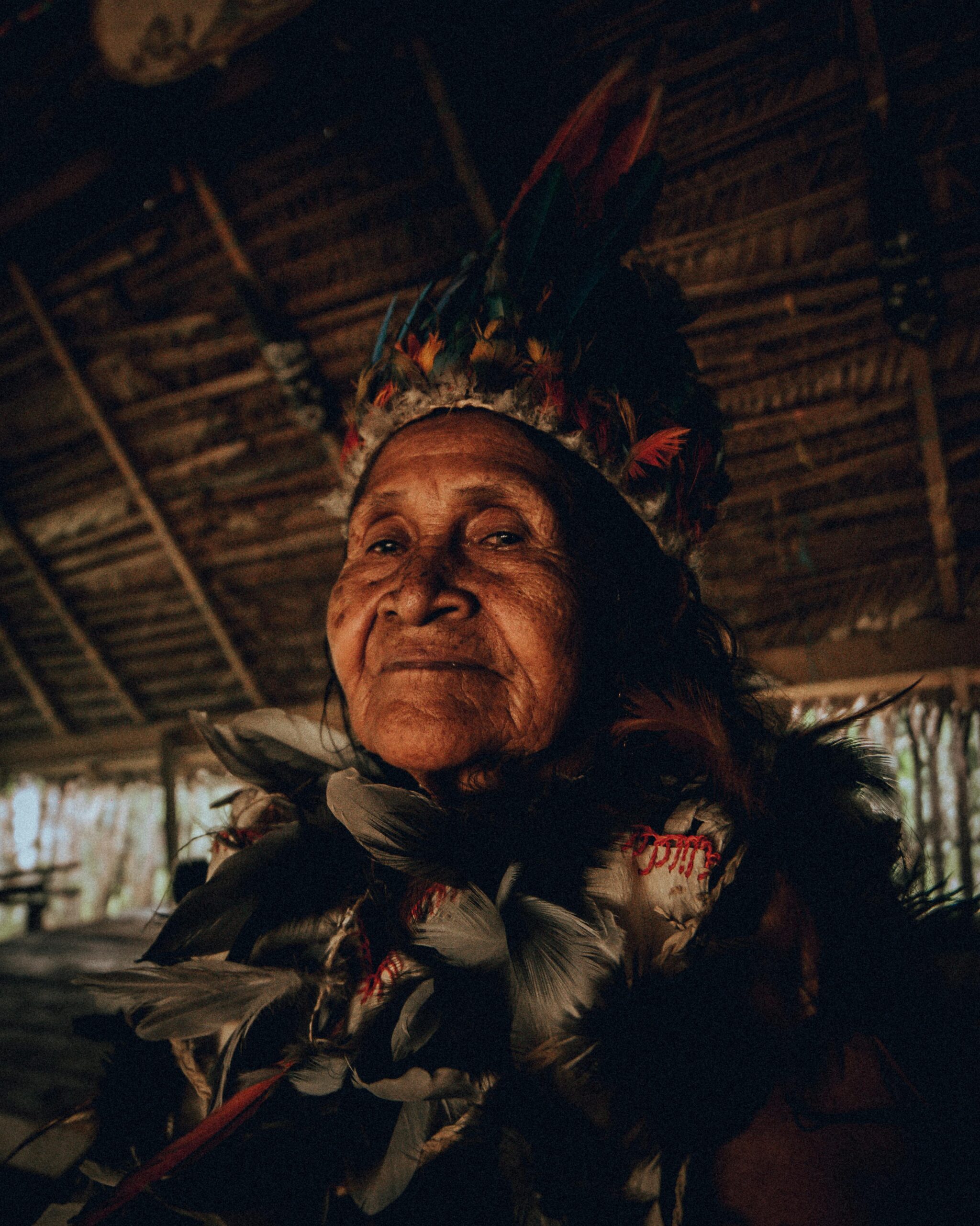 A person who lives in the Amazon, Colombia dressed in ceremonial wear. Photo by Kevin Garcia (Ceremonial wear is not always worn by Indigenous peoples)
