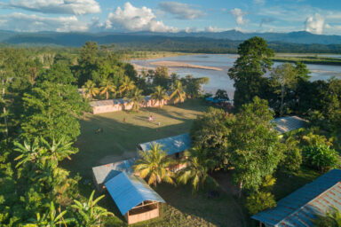 Aerial of an Asháninka village on the edge of the Rio Ene, Peru.