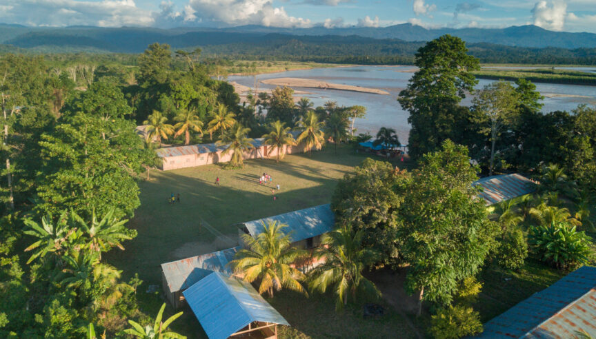 Aerial of an Asháninka village on the edge of the Rio Ene, Peru.